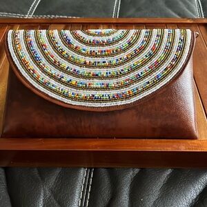 Colorful beaded clutch. Zippered interior.​